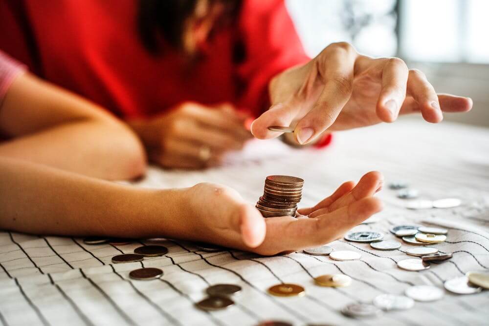 stack of coins in hand