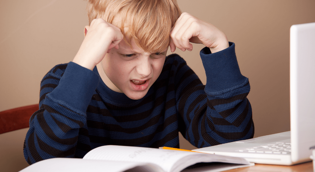 child confused at something in textbook